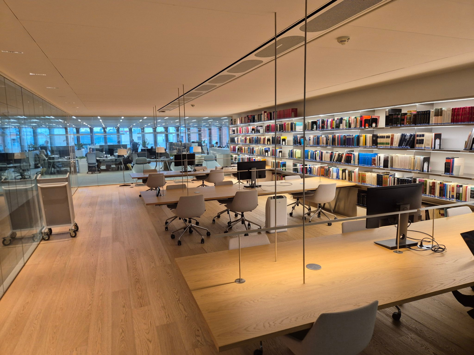Law library workspace with long tables and shelves of books